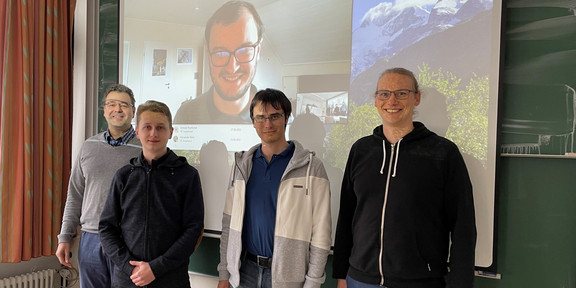 The image shows Norbert Kockmann, Hendrik Borgelt, and Alexander Behr with two guest researchers from the Czech Technical University