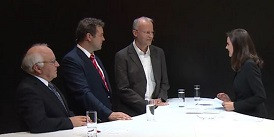 The image shows Prof. Norbert Kockmann during the podium discussion with Dr. Markus Krumme (Novartis AG) and Prof. Rudolf W. Kessler (Steinbeis Transferzentrum) at ACHEMA 2015, moderated by Kay-Sölve Richter (ZDF).