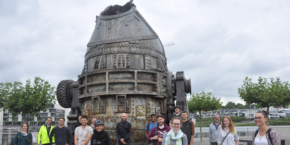 The image shows a group picture of the laboratory of equipment design on a excursion.