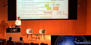 The image shows Norbert Kockmann presenting @ Flow Chemistry Europe.