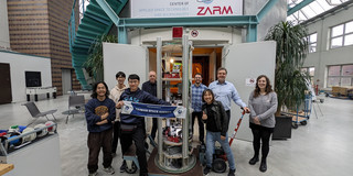 The image shows the Taiwanese research group of Dr. Ya-Yu Chiang and Professor Kockmann