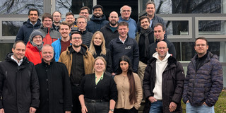 The picture is a group foto of at the 4th status meeting of ENPRO REUNION.