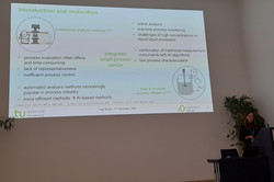 The image shows Inga Burke during her talk at the PEMT.