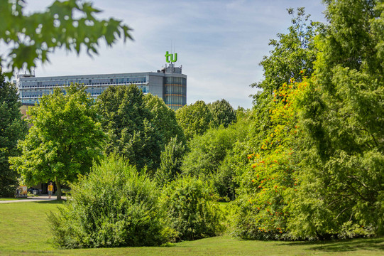The mathematics building with green trees in the foreground.