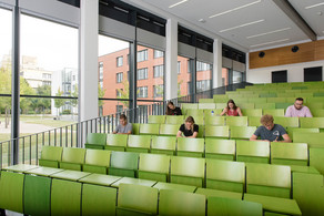 Students are sitting in a lecture hall.